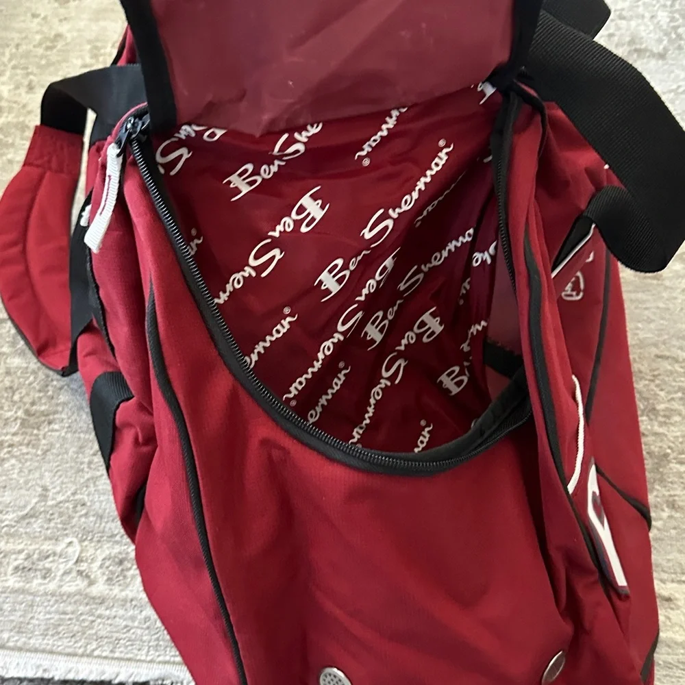 Ben Sherman Burgundy Duffel Bag with Black Accents.